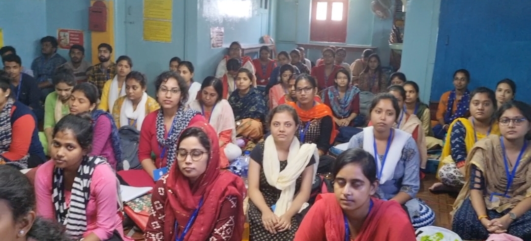 Female students attentively listening during a session