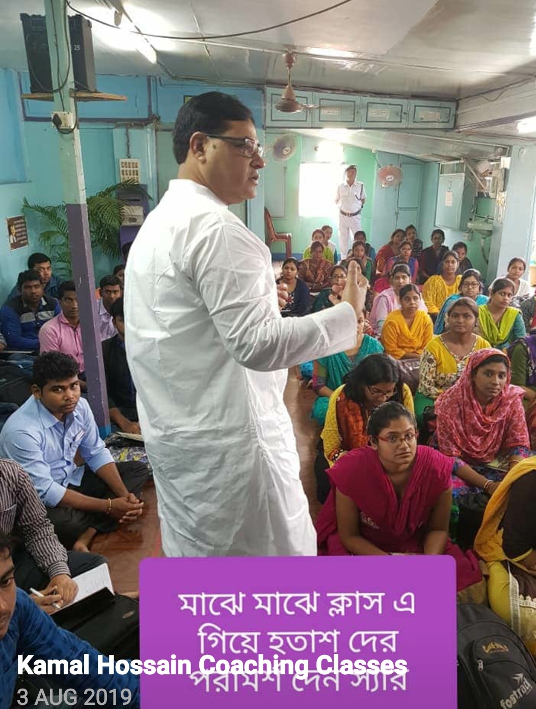 Master Kamal Hossain teaching a class of female students